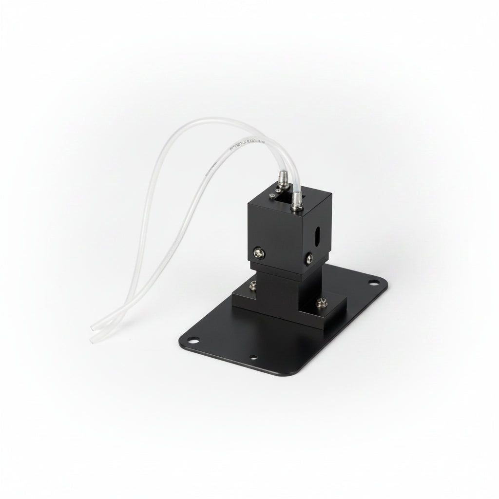 A black metal pump or sensor module with a flat mounting plate and two white tubing wires, shown on a plain white background.
