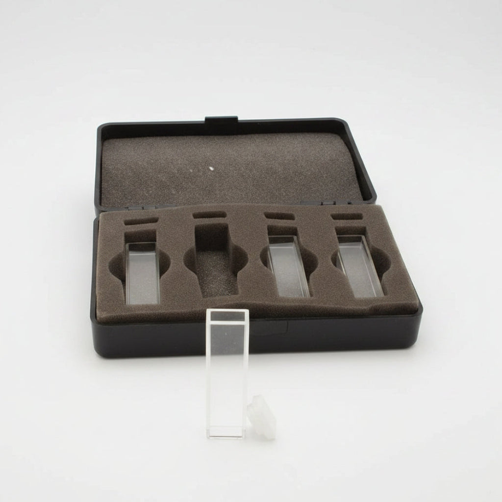 An open black presentation case with a brown foam insert holding several clear rectangular glass slides, shown on a white background with one slide standing upright in front.