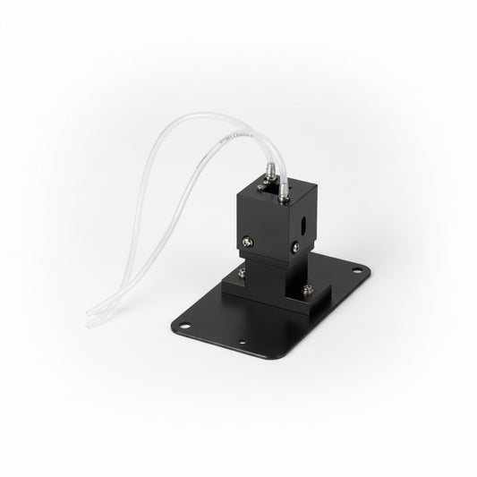 A black metal pump or sensor module with a flat mounting plate and two white tubing wires, shown on a plain white background.