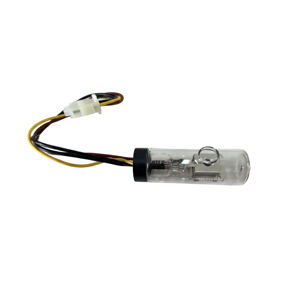 A small transparent cylindrical component with a black cap and attached multicolored wires, photographed on a plain light background.